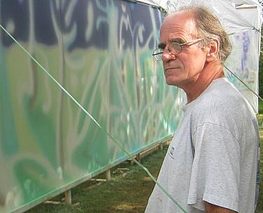Claude Guit&eacute; working on the restoration of the 'Hiver' mural