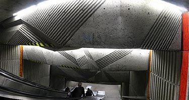 Bas-relief over an escalator well