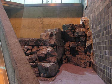 Limestone outcropping preserved behind staircase to the Saint-Michel line