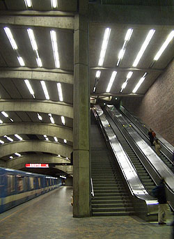 Escalator well separated from main volume
