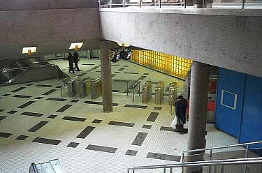 Blue-toned walls and glass bricks in the north mezzanine