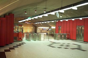 Red-toned walls and glass bricks in the south mezzanine
