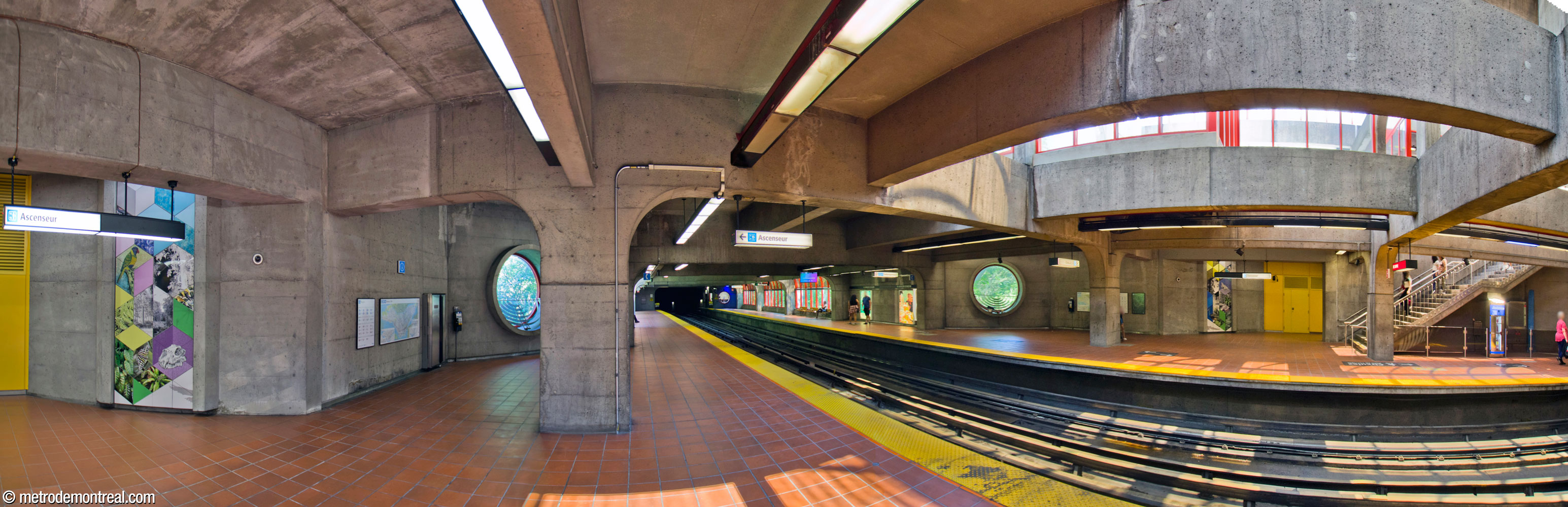 Panoramic view of the centre of the platforms, showing the two sections of Shelley Miller's artwork Les boîtes vivantes facing each other across the tracks.