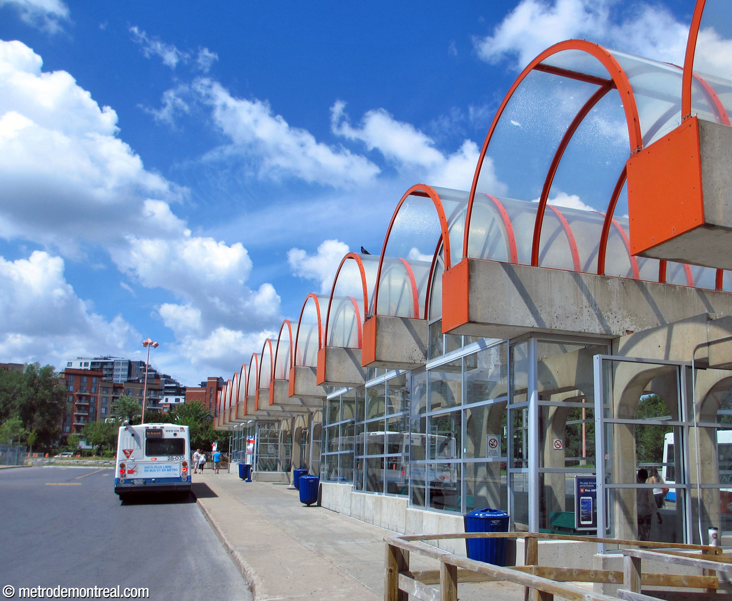 Awnings formed by the ceiling domes along the central pier of the bus terminal to the northwest of the station headhouse.