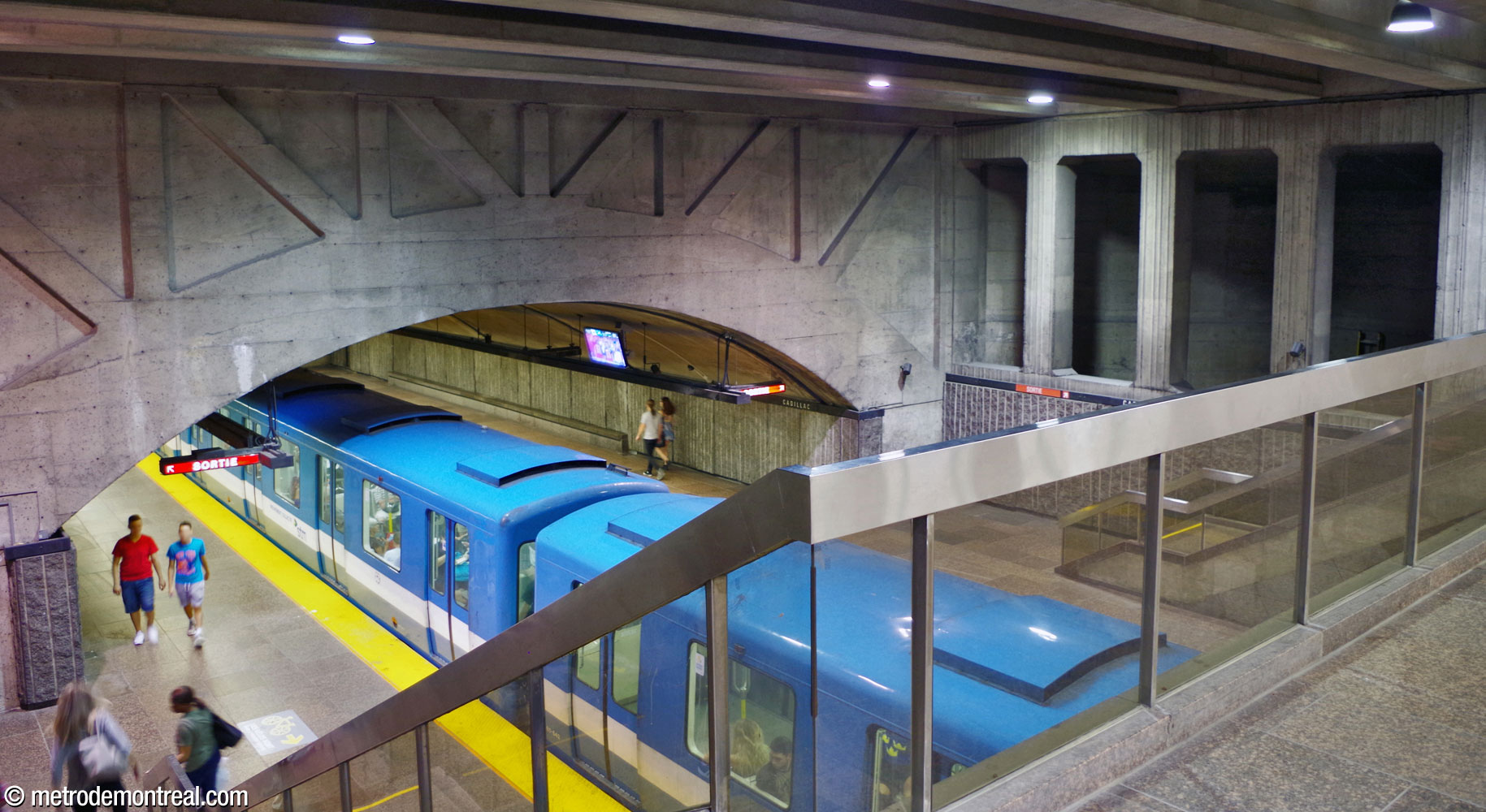 View from the mezzanine level overlooking the station's main volume. Note the dark openings of the ventilation shaft at right.