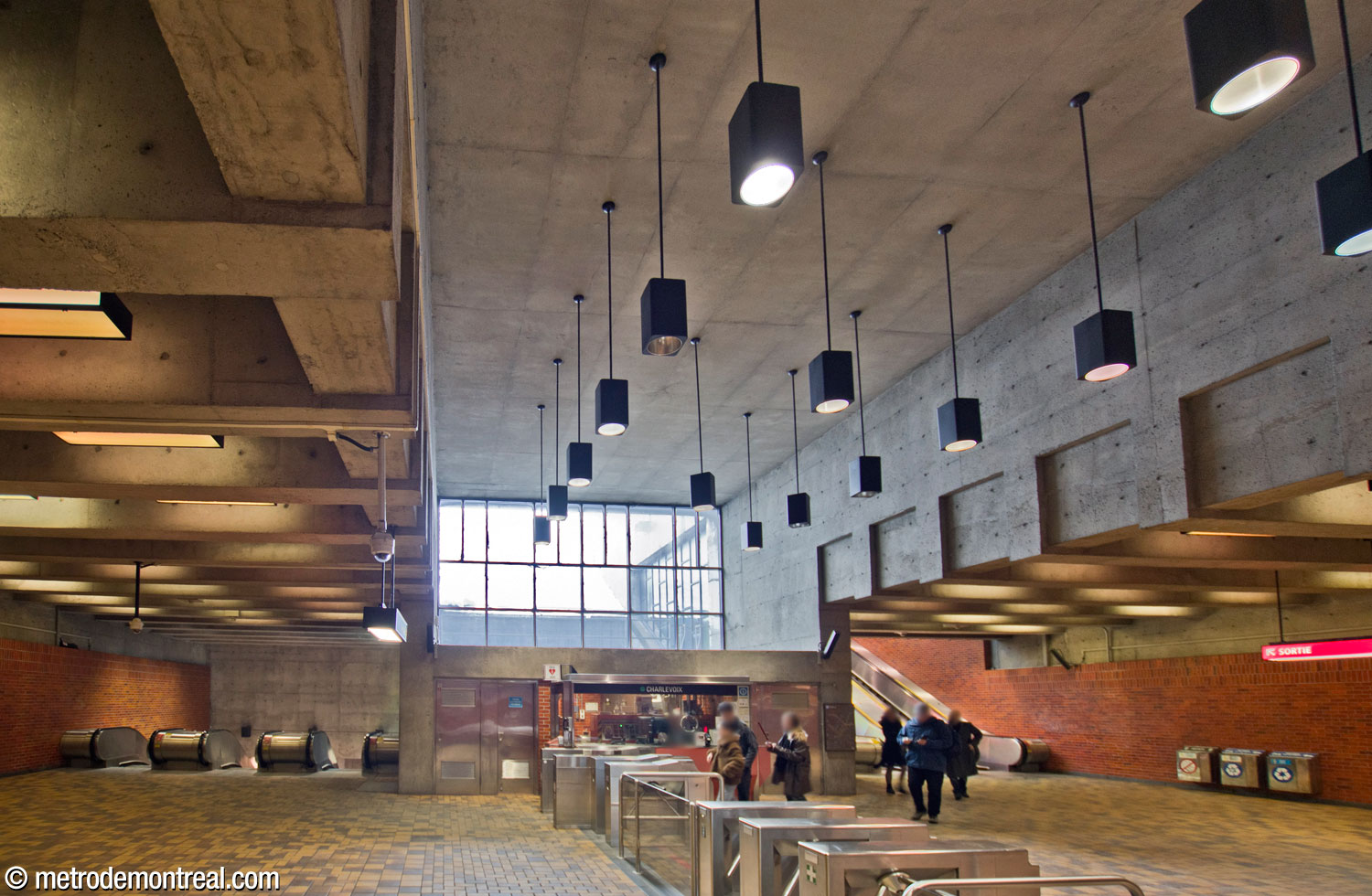 Another view of the ticket hall, looking toward the ticket booth, the light shaft window above it, and the stairwells leading down (left) and up (right).