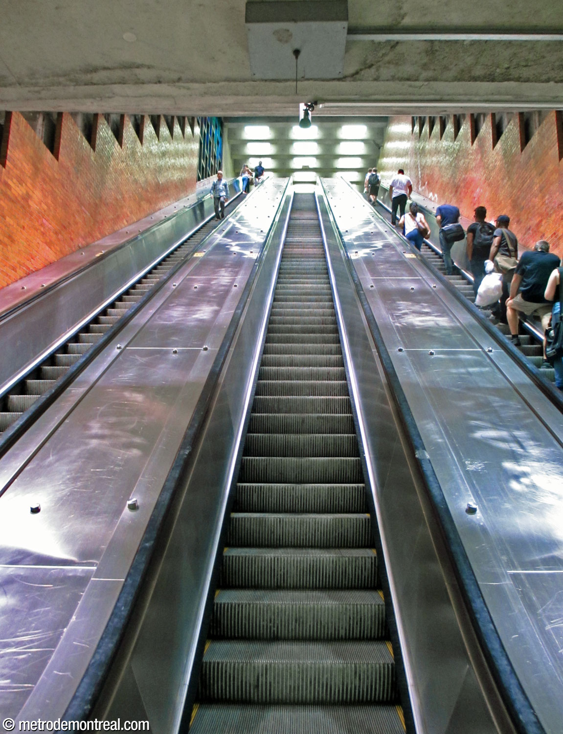The escalators from the platforms to the ticket hall, seen from their foot. The impression of depth is stronger from this point of view.