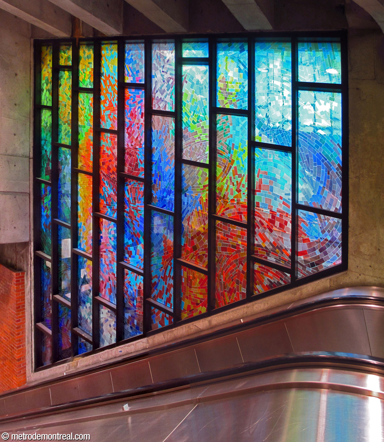 Nicola Corrado, the lower of the two stained glass windows by Mario Merola and Pierre Osterrath, located at the top of the escalators between the ticket hall and the platforms.