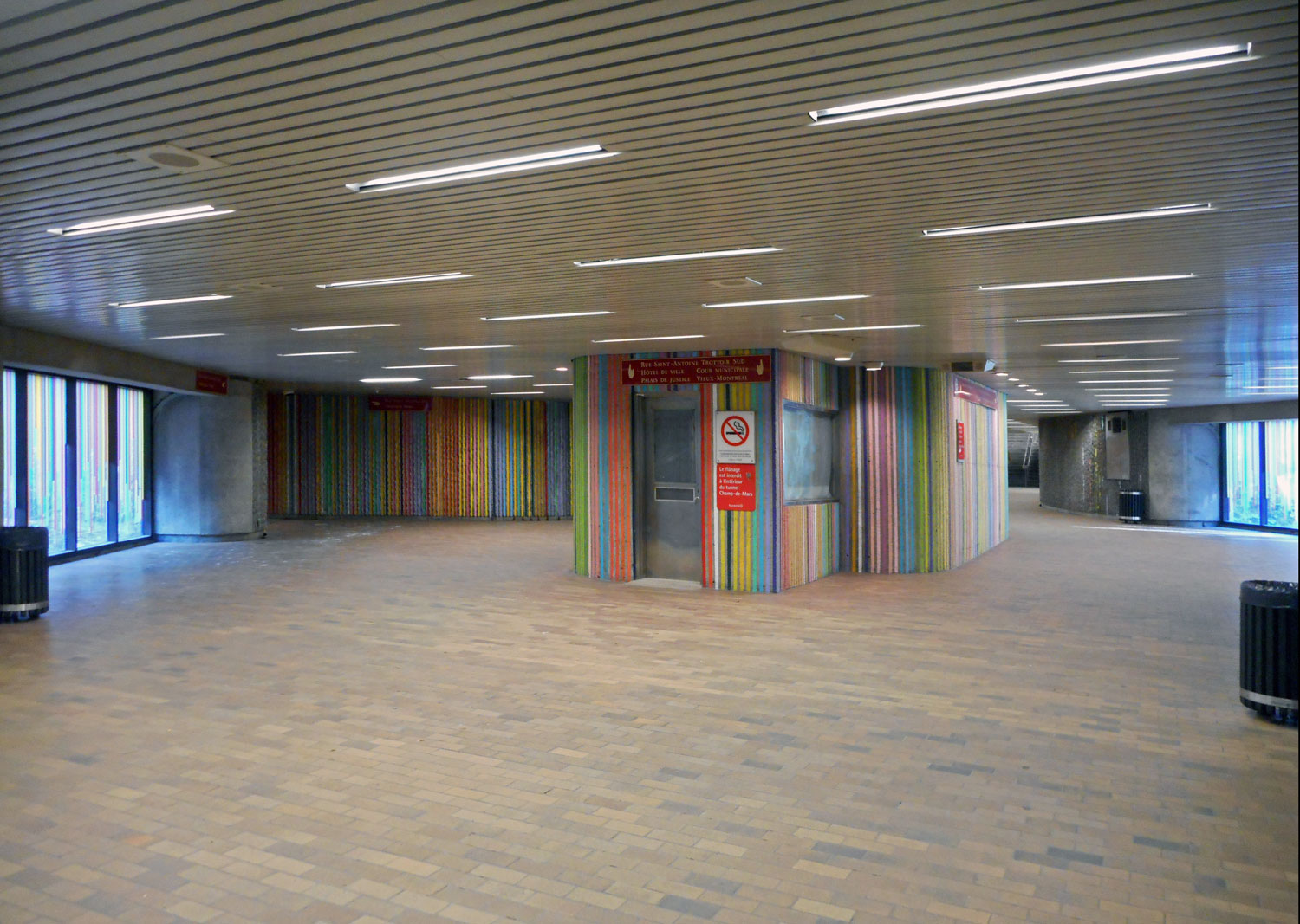 Interior view of the Champ-de-Mars tunnel, featuring the mural Printemps by Philippe Allard of MU Art.