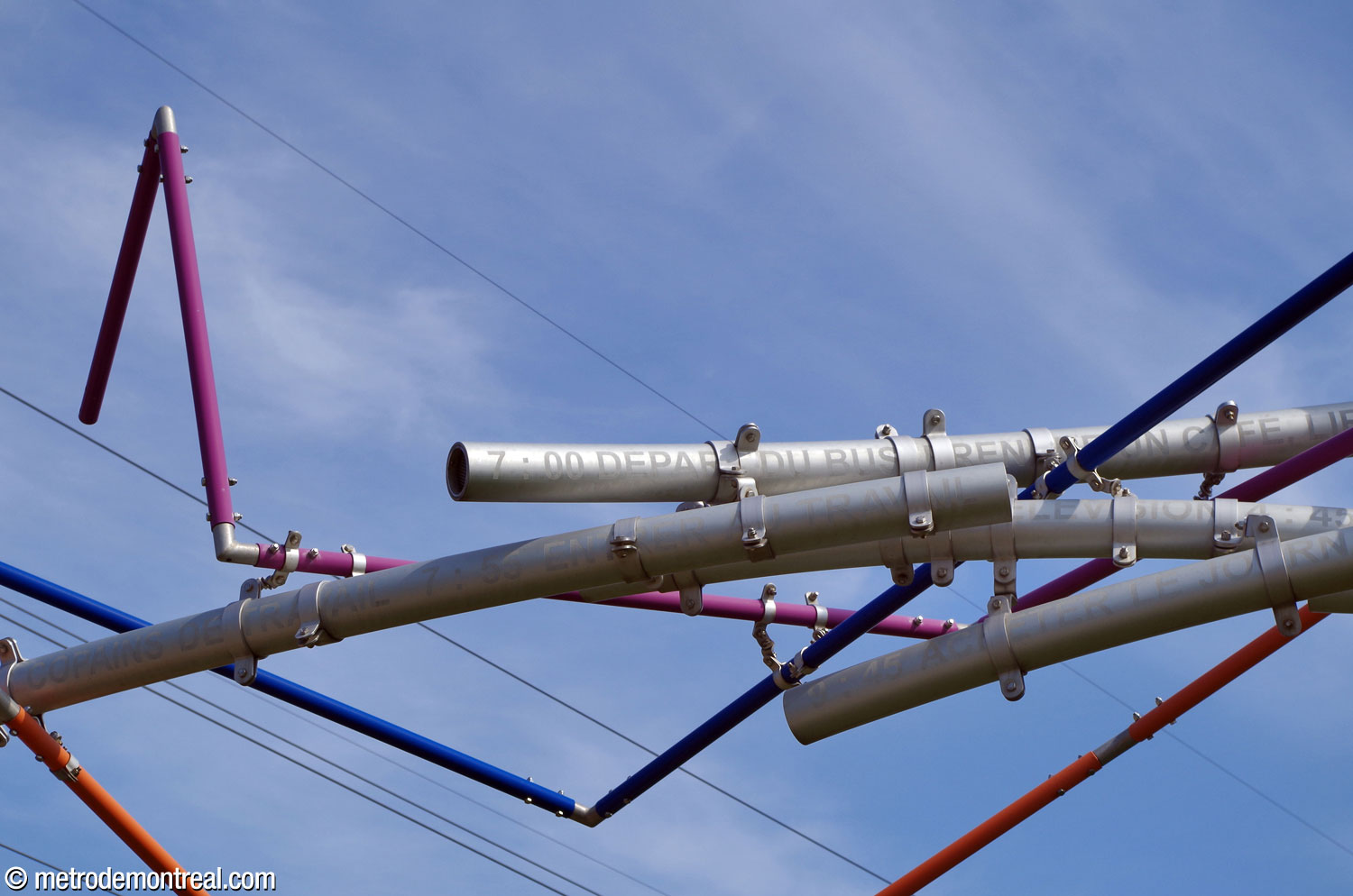 Detail of Nos allers-retours by Yves Gendreau, showing the inscriptions on the metal tubes.