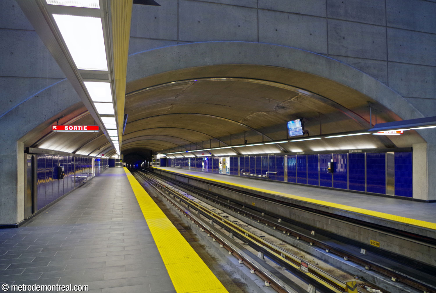 The platforms, built in tunnel, extend out from the main volume.