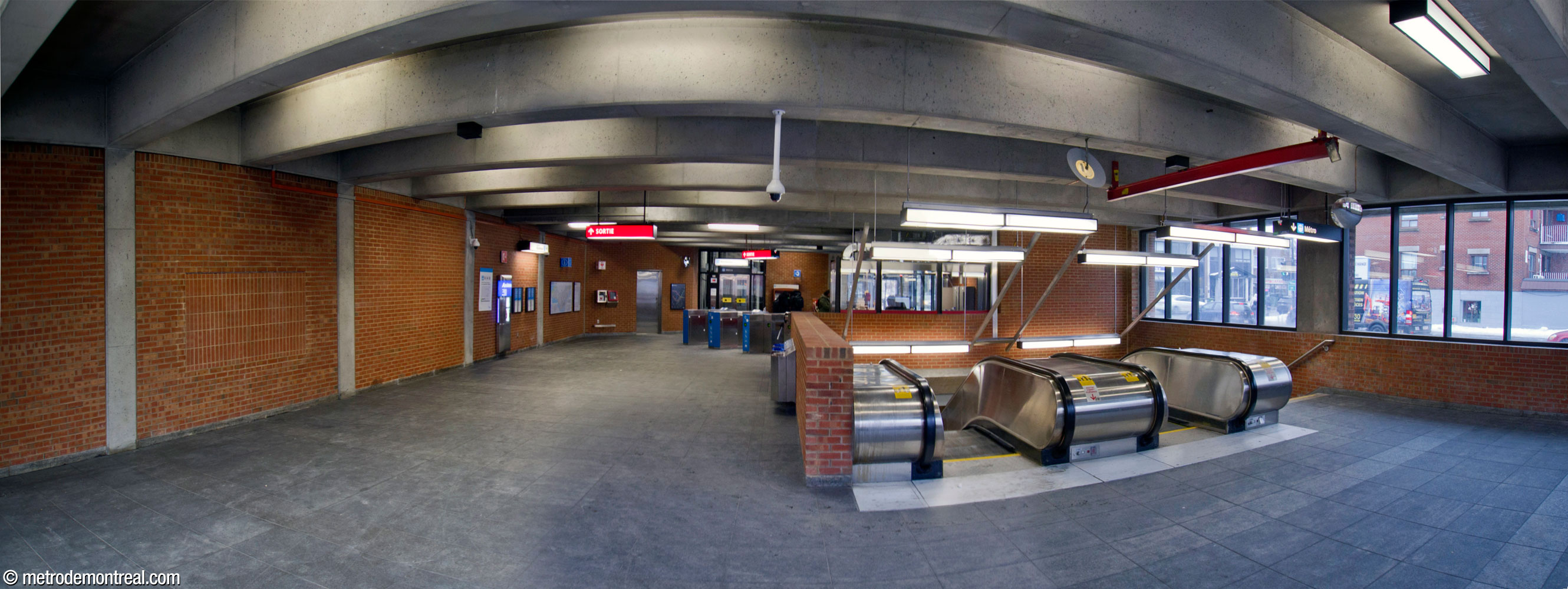 The eastern headhouse seen from its rear, with the stairwell to the platforms at right; the elevator is located at the far end, adjacent to the entrances and gateline.