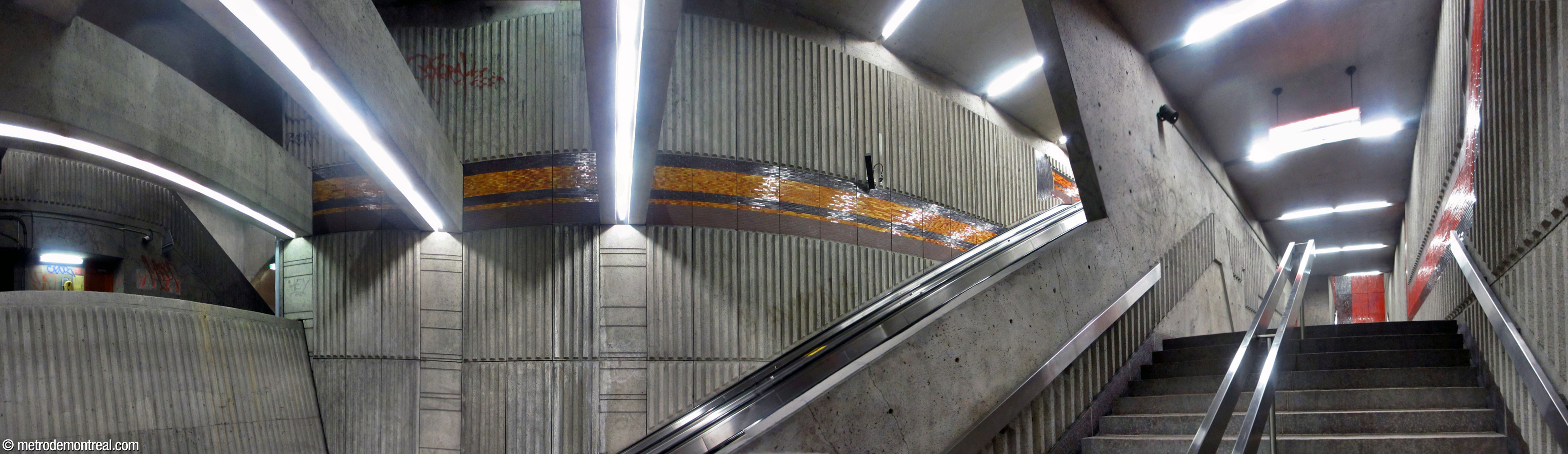The stair and escalator well connecting the Angrignon platform to the Wellington transept.