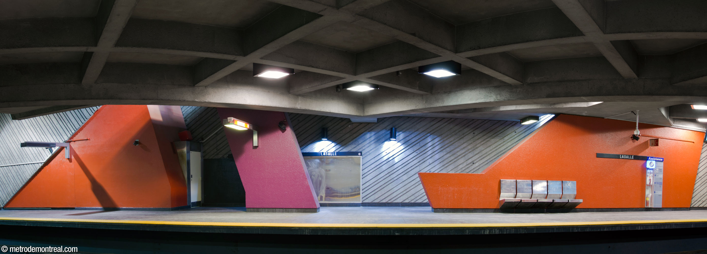 One of two stairways from the Angrignon platform to the mezzanine is surrounded by coloured forms by Michèle Tremblay-Gillon. To the left, a technical facility has been subsequently integrated into one of the red forms.