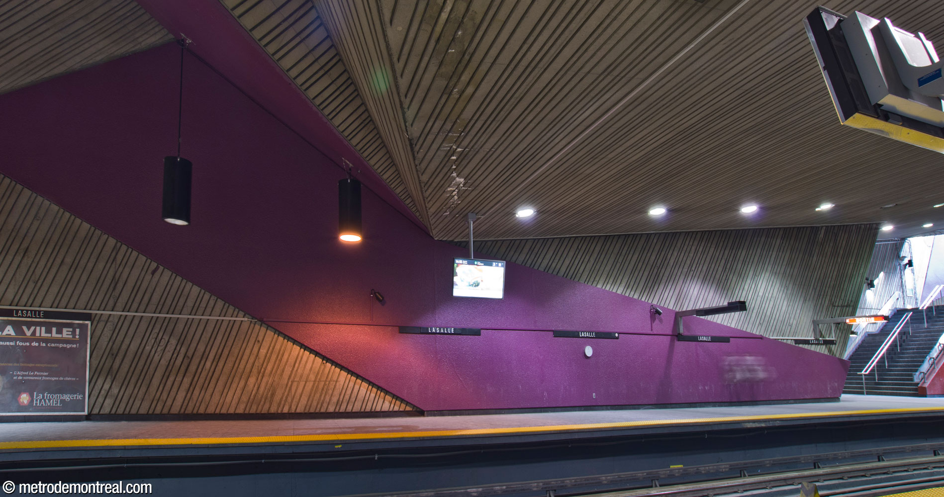 A purple concrete form by Michèle Tremblay-Gillon forms an arch over the tracks.