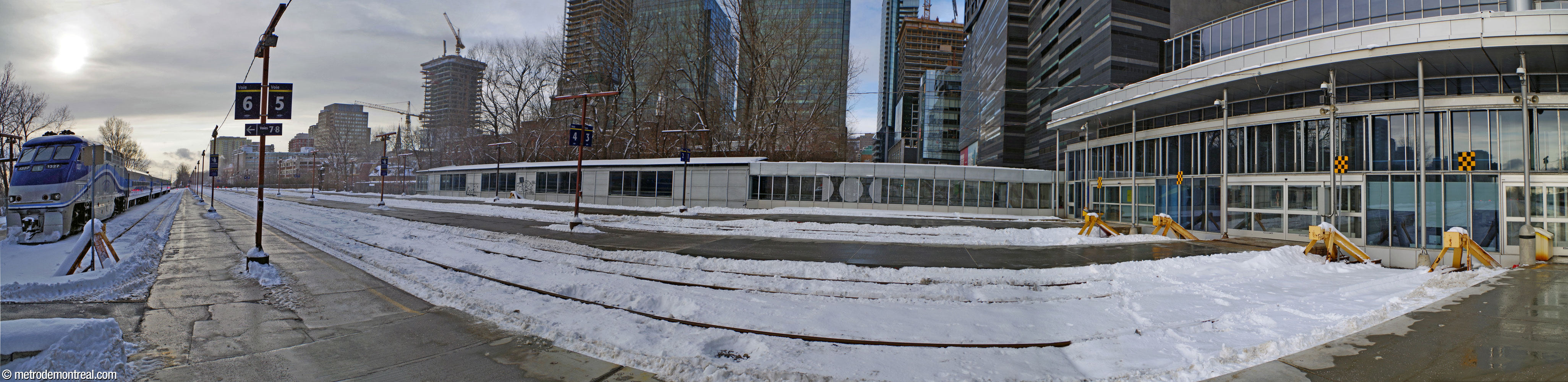 The commuter train station before its renovation and the construction of canopies in 2024.