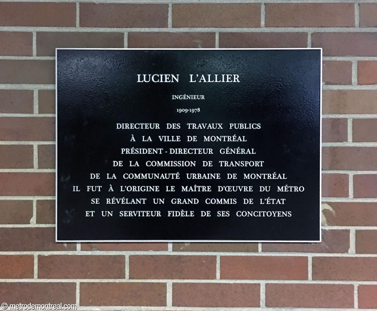 Commemorative plaque in honour of Lucien L'Allier, in the uppermost landing