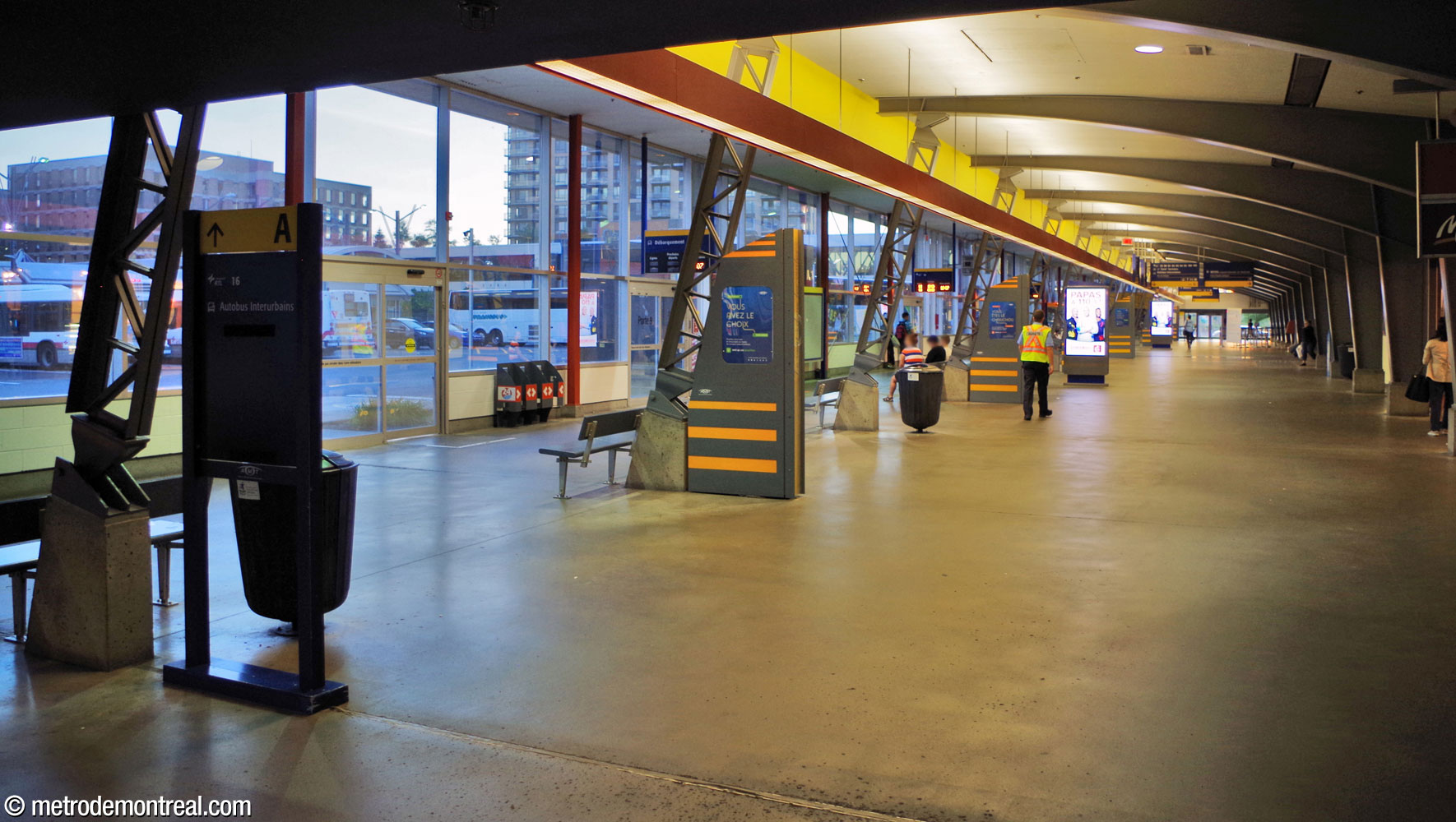 The A wing of the bus terminal. Like much of the facility, its wall facing the bus driveways is almost entirely glazed.