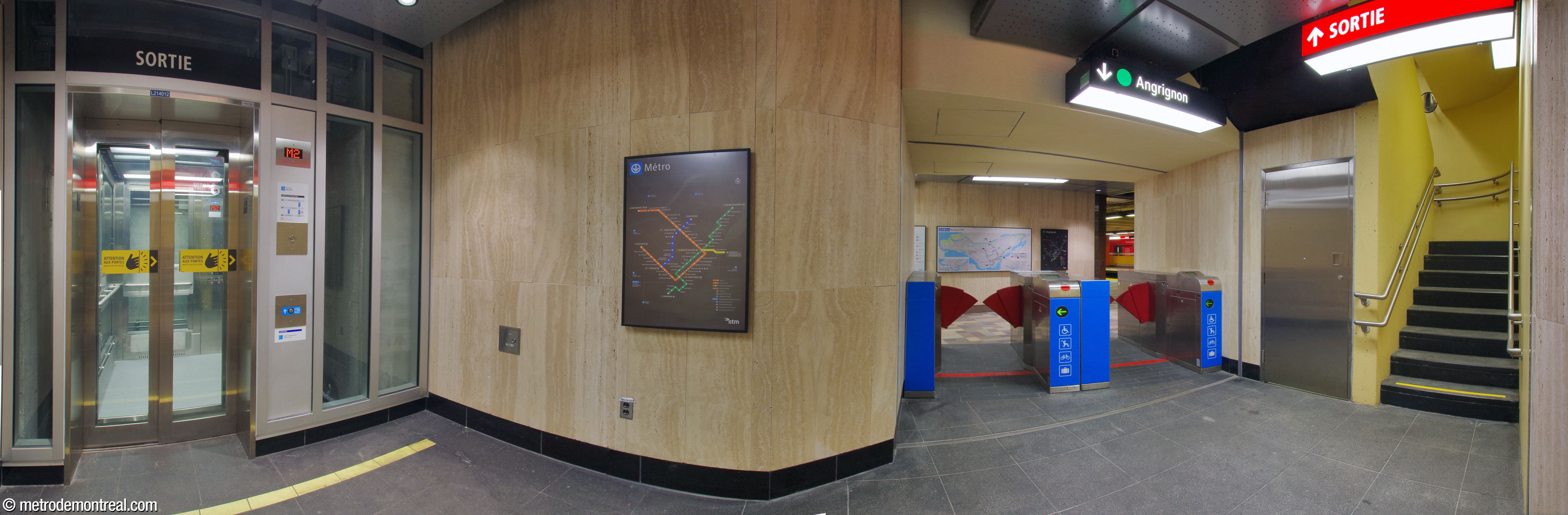 The small landing and independent gateline at the eastern end of the Angrignon platform, at the foot of the elevator (left) and narrow stairwell (right) to the ticket hall level and surface.