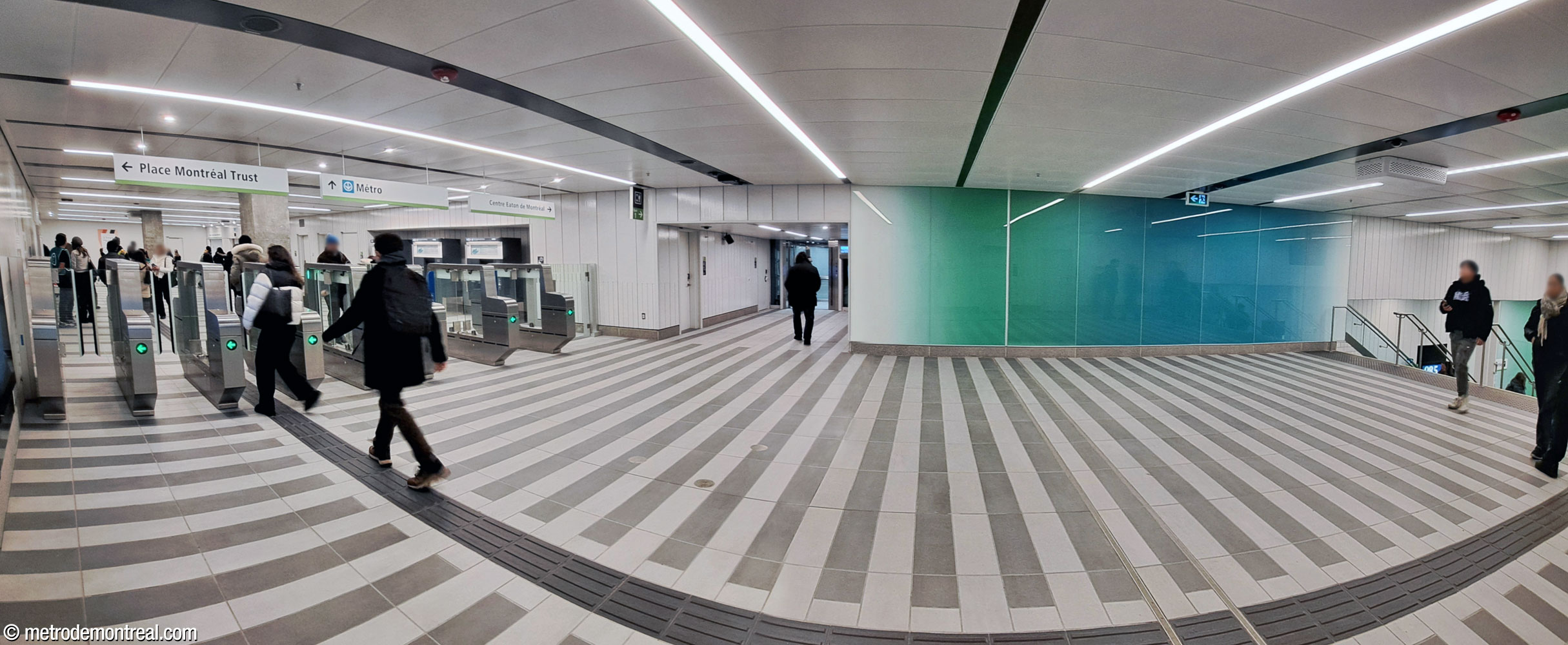 The fare-paid zone of the south ticket hall. The stairs to the platforms are at far right; at centre is the elevator to the northbound platform.