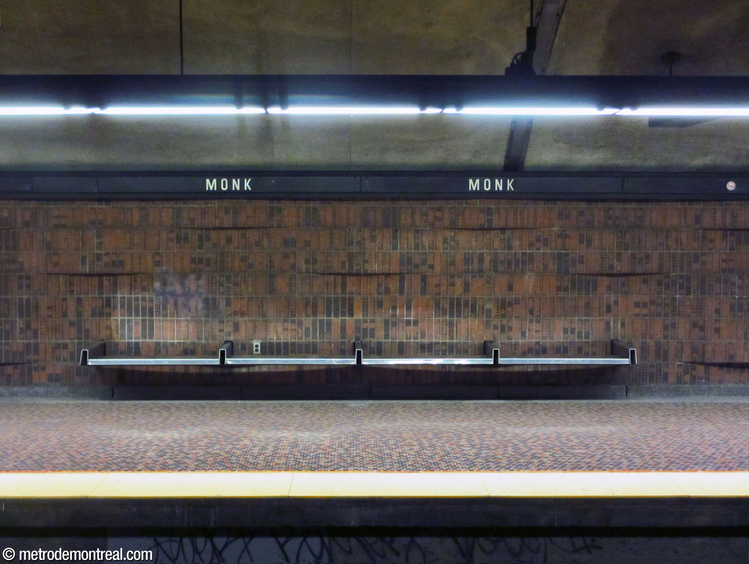 One of the stainless steel benches at the platform level.