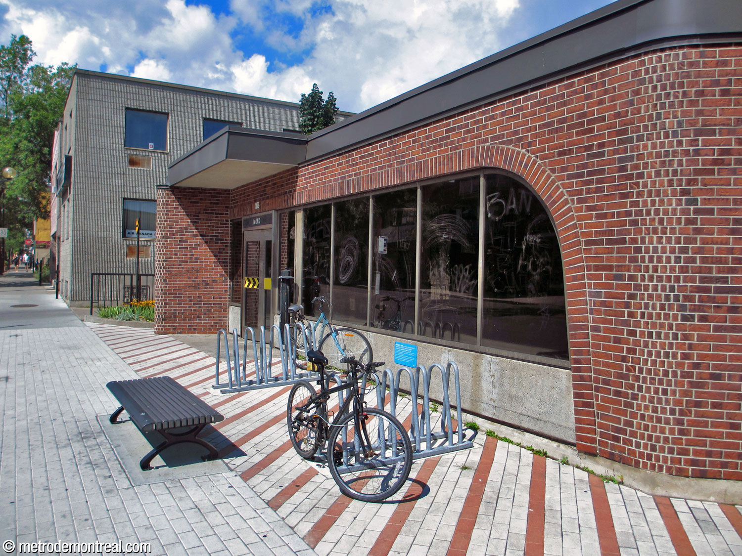 Closer view of one of the entrances to the Monk Nord headhouse. The door and windows are integrated together within a curved brick frame.
