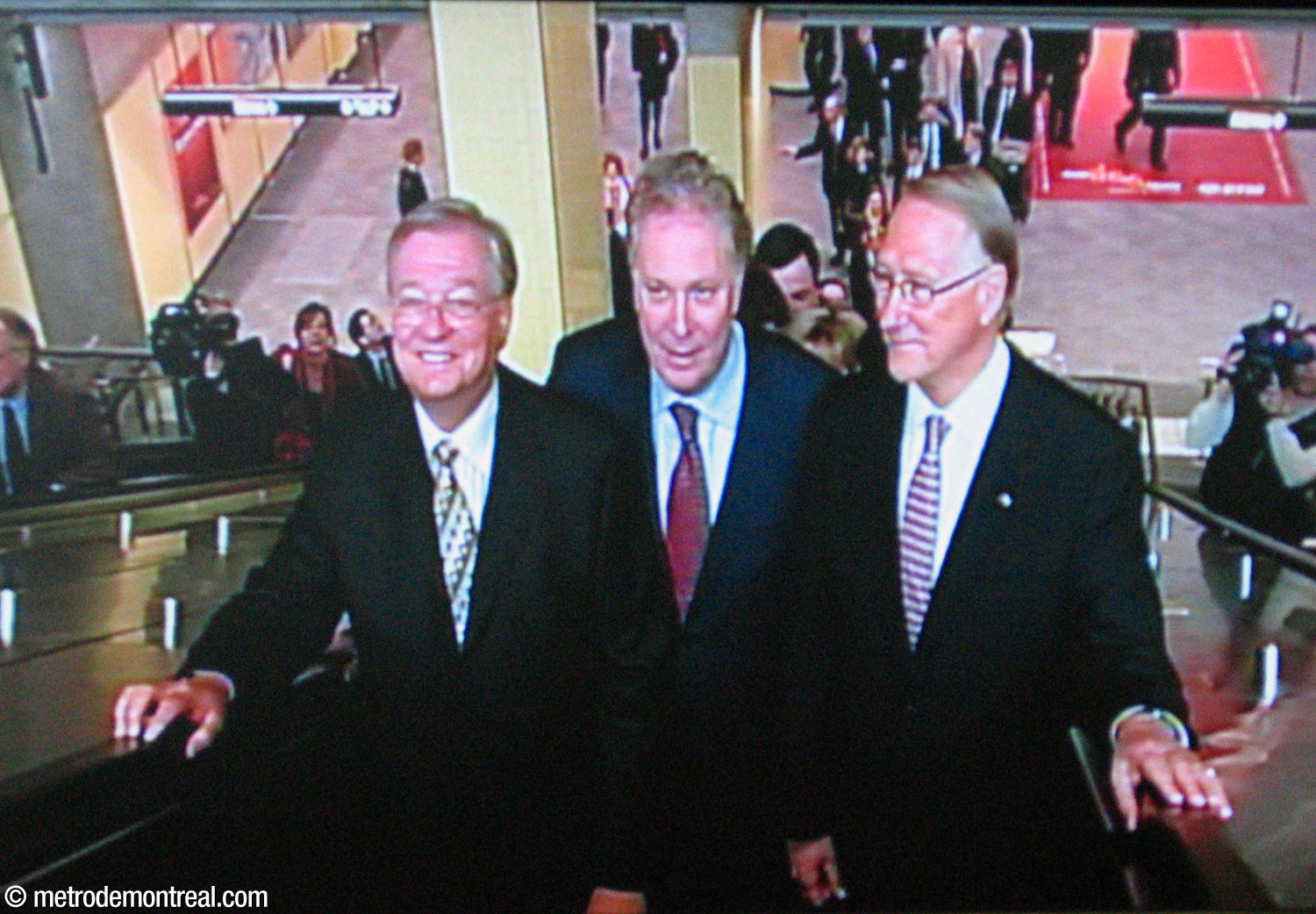 Quebec Premier Jean Charest, centre, makes his way to the inauguration ceremony accompanied by Laval Mayor Gilles Vaillancourt (left) and Montreal Mayor Gérald Tremblay.