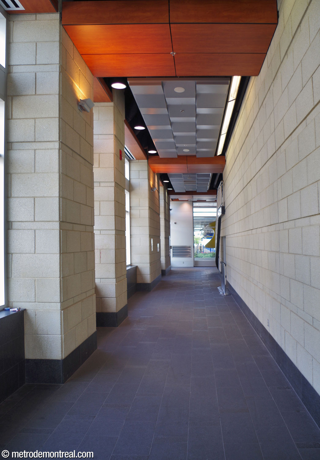 The narrow hallway from the main entrance to the bus terminal building to the terminal waiting area.