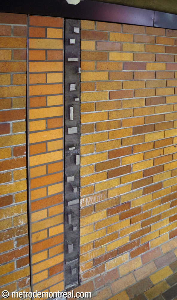 One of Charles Daudelin's 32 sculptural aluminum wall seams on a platform wall.