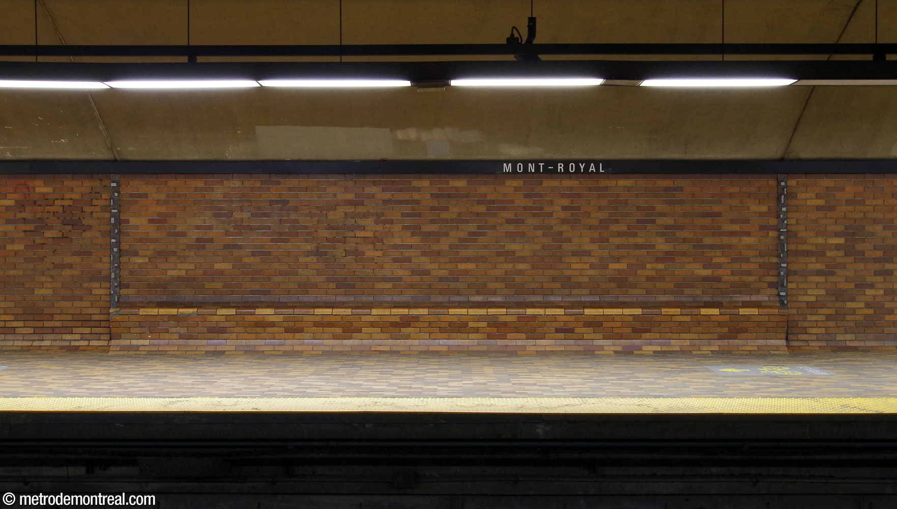 One of the platform benches, built into the wall, and flanked by two of Charles Daudelin's sculptural aluminum wall seams.
