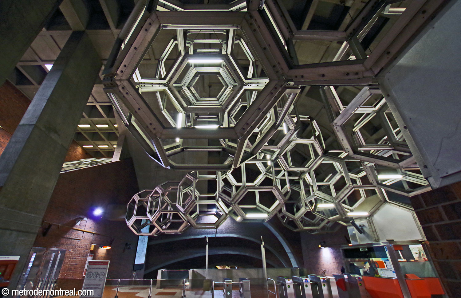 View of Système from the north side of the ticket hall, looking up through several of its modules.
