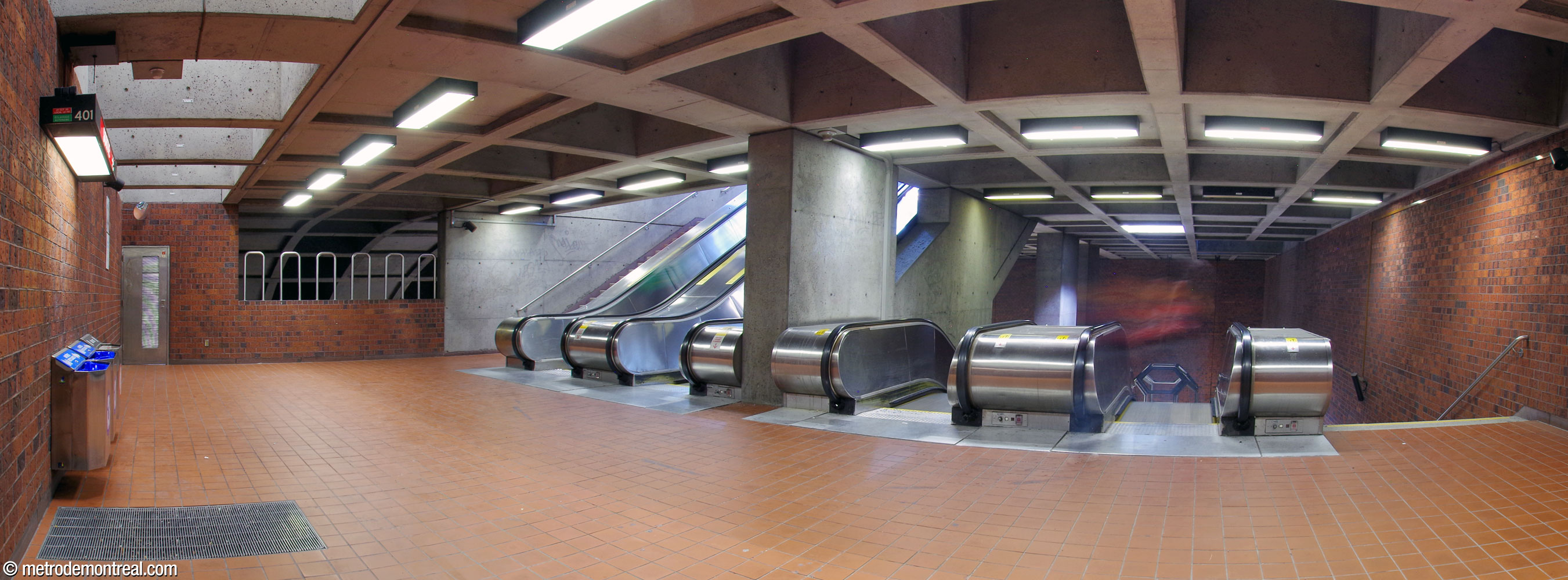 The landing below the headhouse. At left, an overlook looks onto the main volume below; the curved ceiling of the volume is visible.