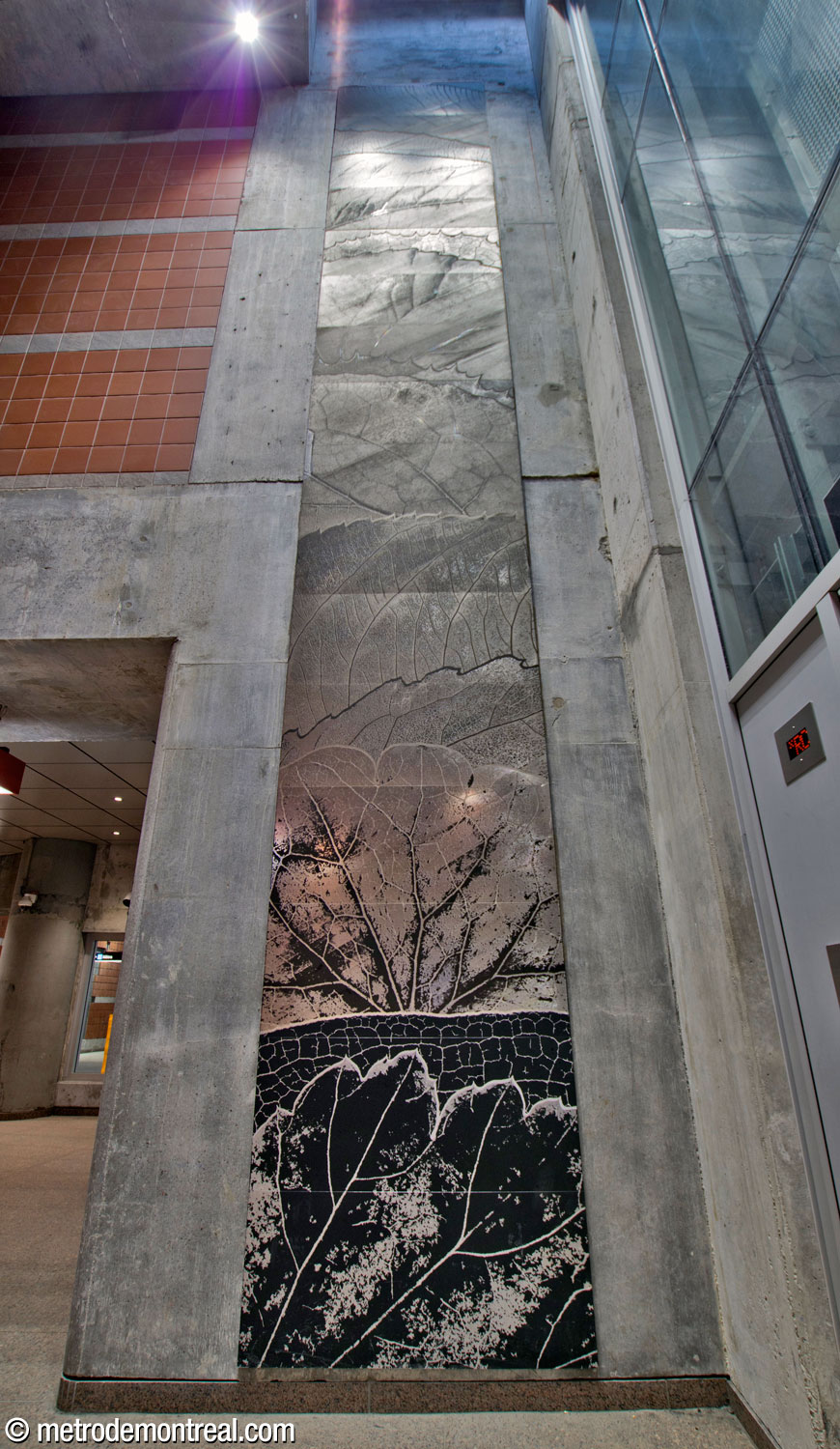 Strates, a metal mural by Josée Pedneault, occupies the high wall next to the elevator shaft.