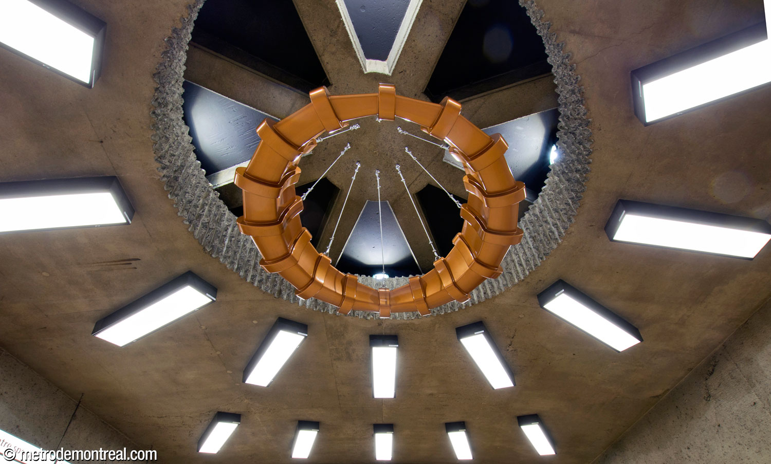 The easternmost of the three suspended sculptures in the concourse, part of the work Point de mire by Francis Montillaud, this one coloured bronze.