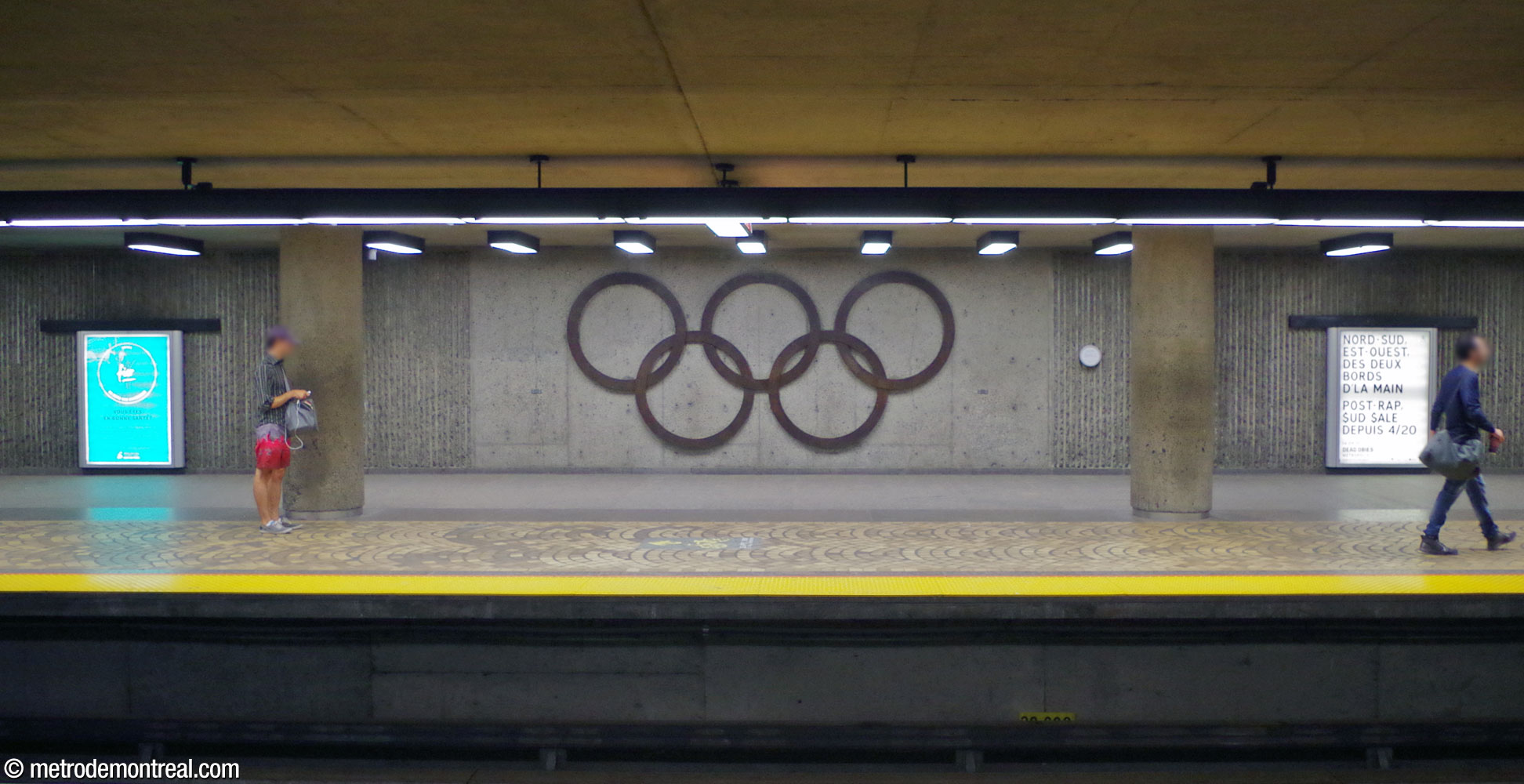 A bronze representation of the Olympic rings by station architect Marcel Raby, at the centre of the Angrignon platform.