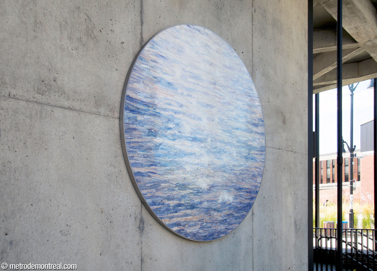 The upper section of Rives scintillantes by Véronique La Perrière M, a circular blue and white mosaic in the Place Saint-Henri headhouse.