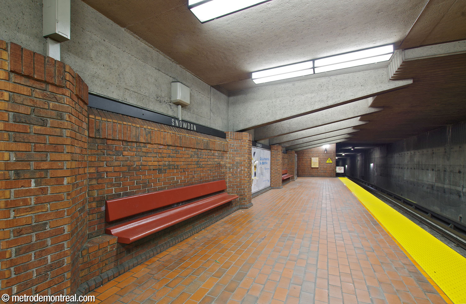 The end of one of the lower platforms, showing the low ceiling punctuated by corbels supporting the platform above.