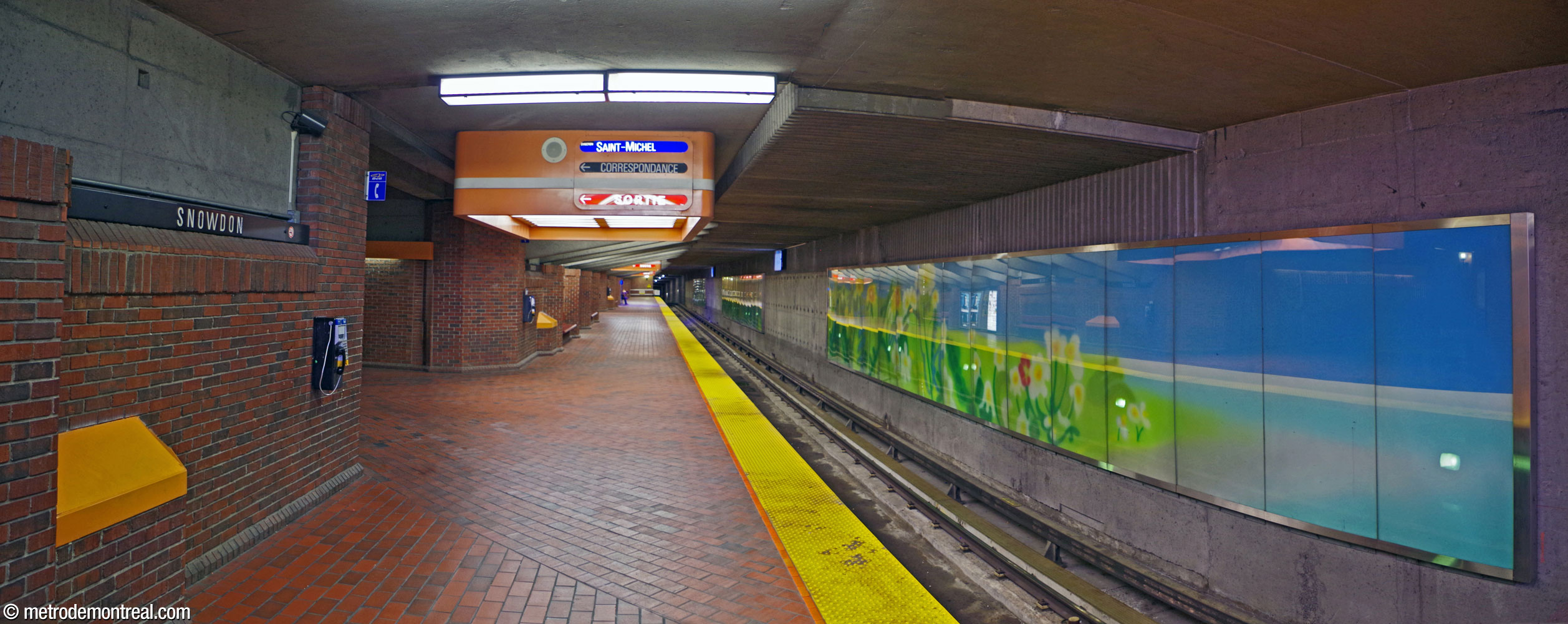 View of the Saint-Michel platform, showing the reinstalled sections of the 'summer' component of the mural cycle Les quatre saisons by Claude Guité. Also notice the unusual square signage and lighting module in the ceiling above the platform access.