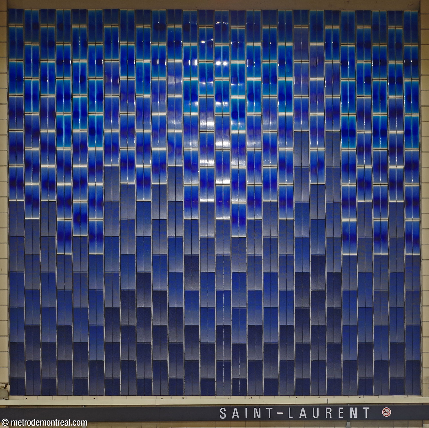 One of the ceramic murals by Claude Vermette located on the upper part of the walls above the platforms. Two of the murals are in royal blue tones like this one.