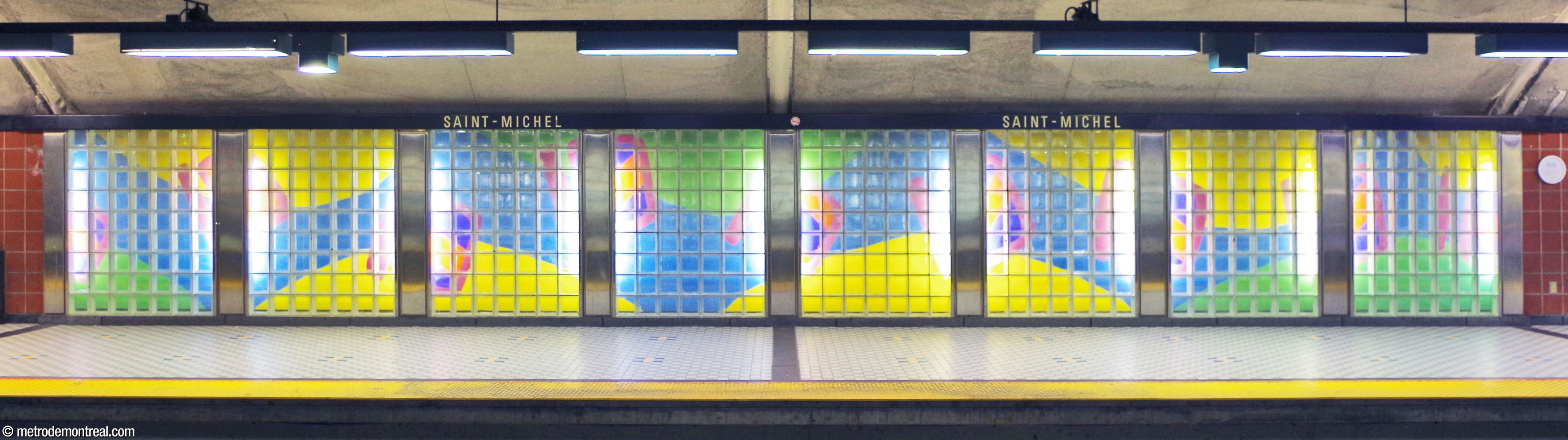 Mural by Marcelin Cardinal, located near the west end of the departure platform, with brightly coloured abstract shapes.