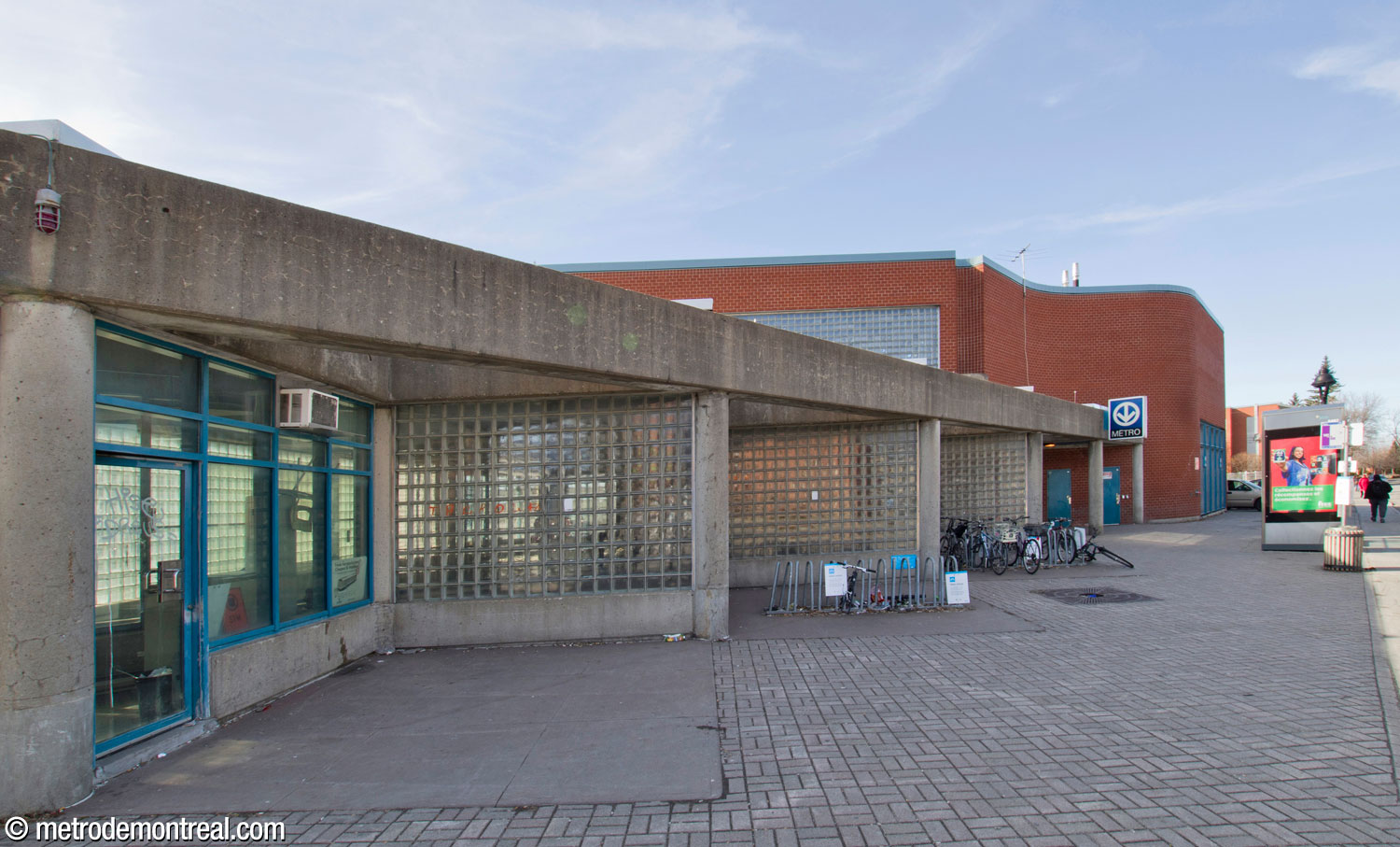 The eastern façade of the east headhouse, along Boulevard Shaughnessy. The zigzag glass brick walls admit sunlight to the volume below.