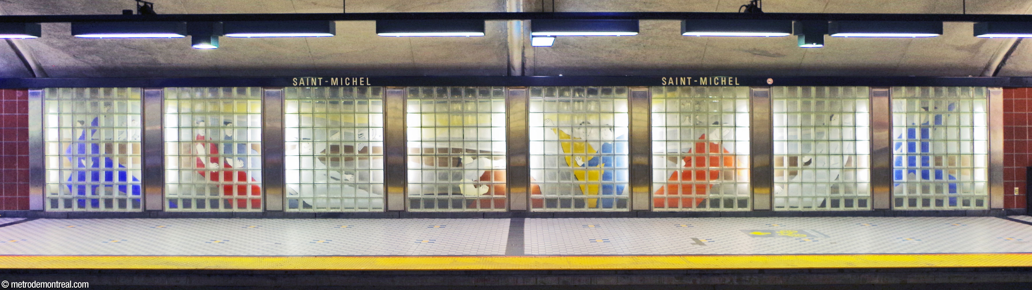 Mural by Charles Lemay, located on the departure platform near the stairs, with human figures on a grey background.