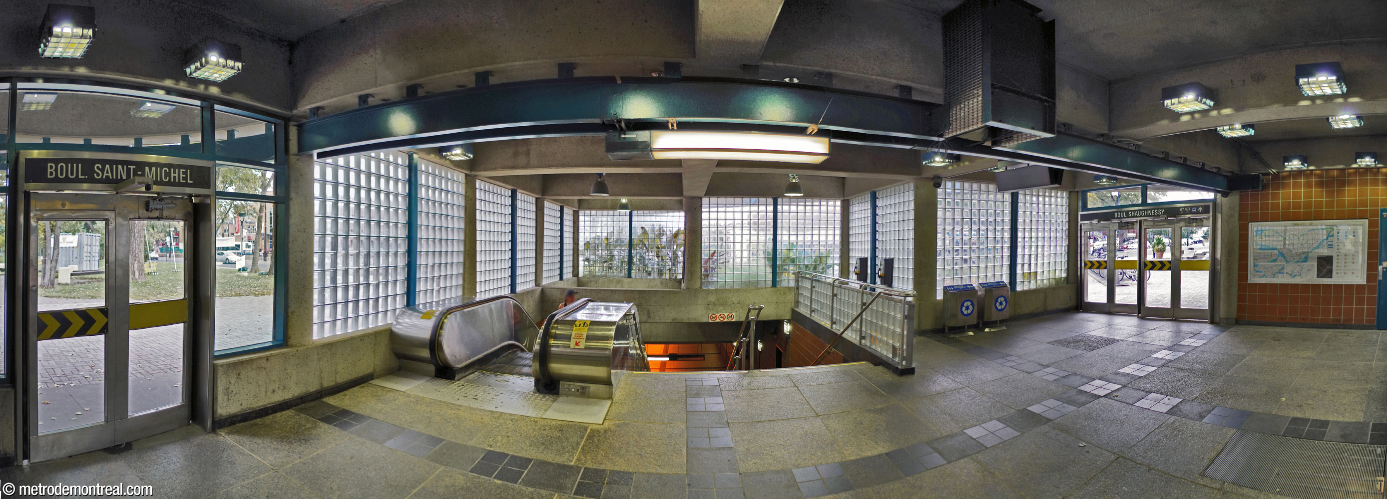 The interior of the smaller west headhouse, brightly sunlit via its glass brick walls. The north entrance is at left, the south (closer to the intersection) at right.