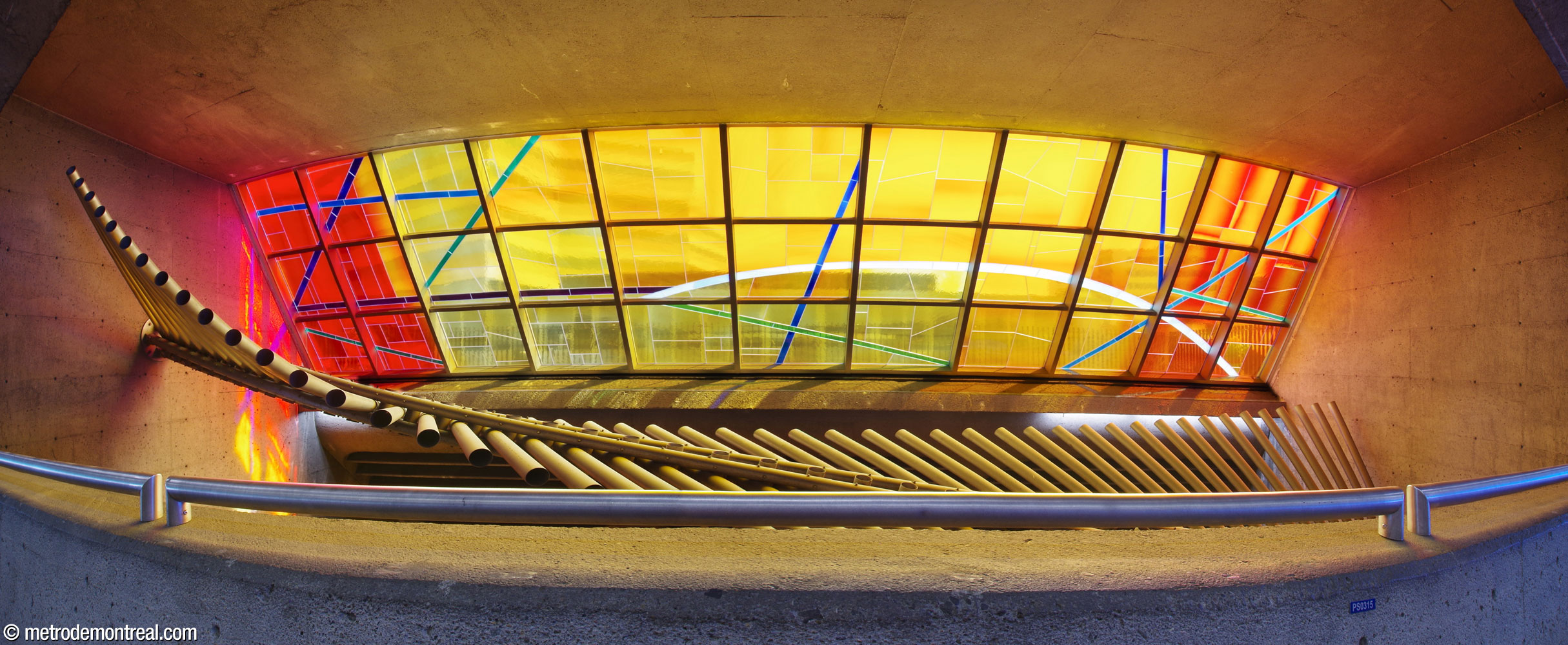 Marcelle Ferron's stained glass window and metal sculpture in the volume over the tracks, seen from the bridge.