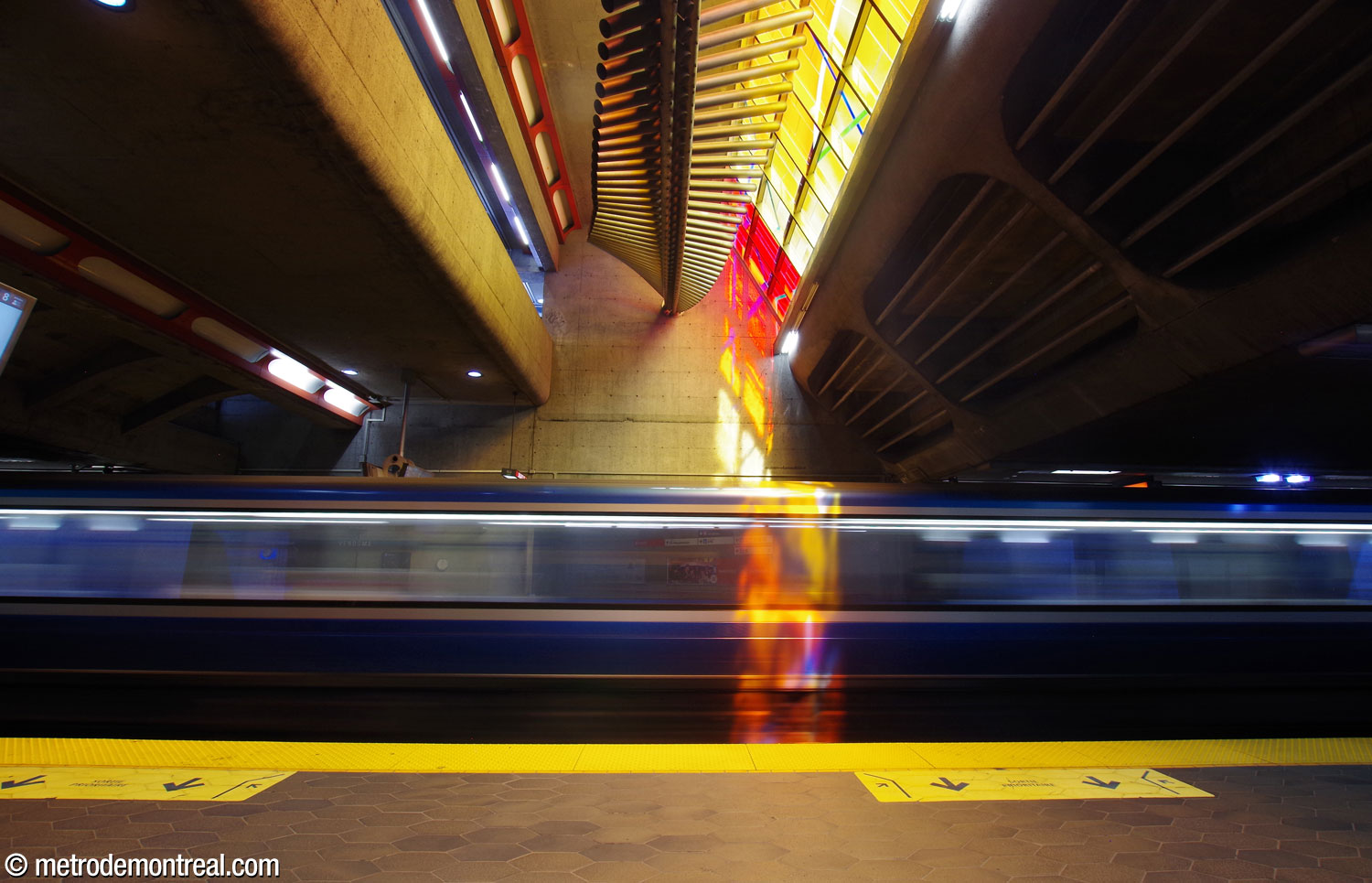 The volume above the trainroom within the original headhouse, incorporating Marcelle Ferron's stained glass window and sculpture. Especially in the morning, the stained glass sends shafts of vividly coloured sunlight onto the rails and platforms below.
