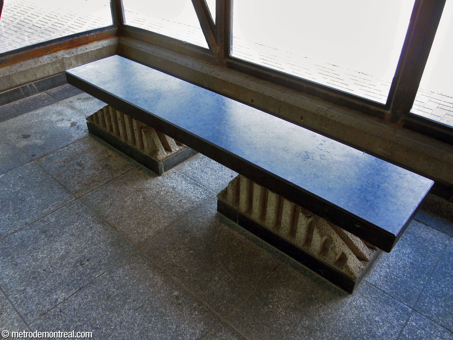 Black granite bench with concrete feet in the north headhouse.