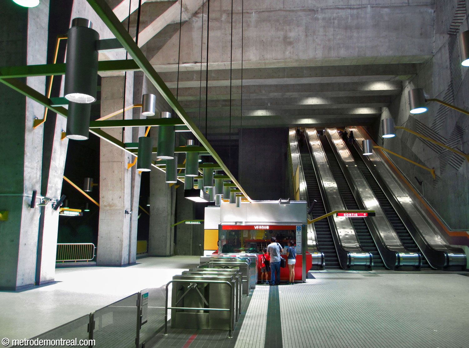 View of the ticket hall, looking along the turnstiles and up the escalators.