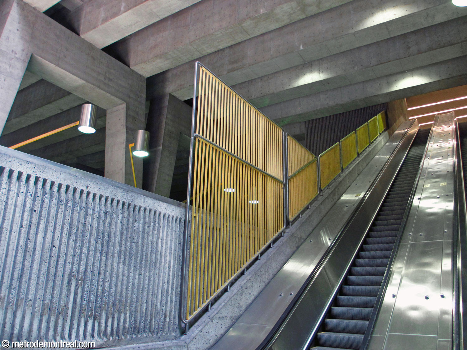 Protective grille along the escalators over the ticket booth.