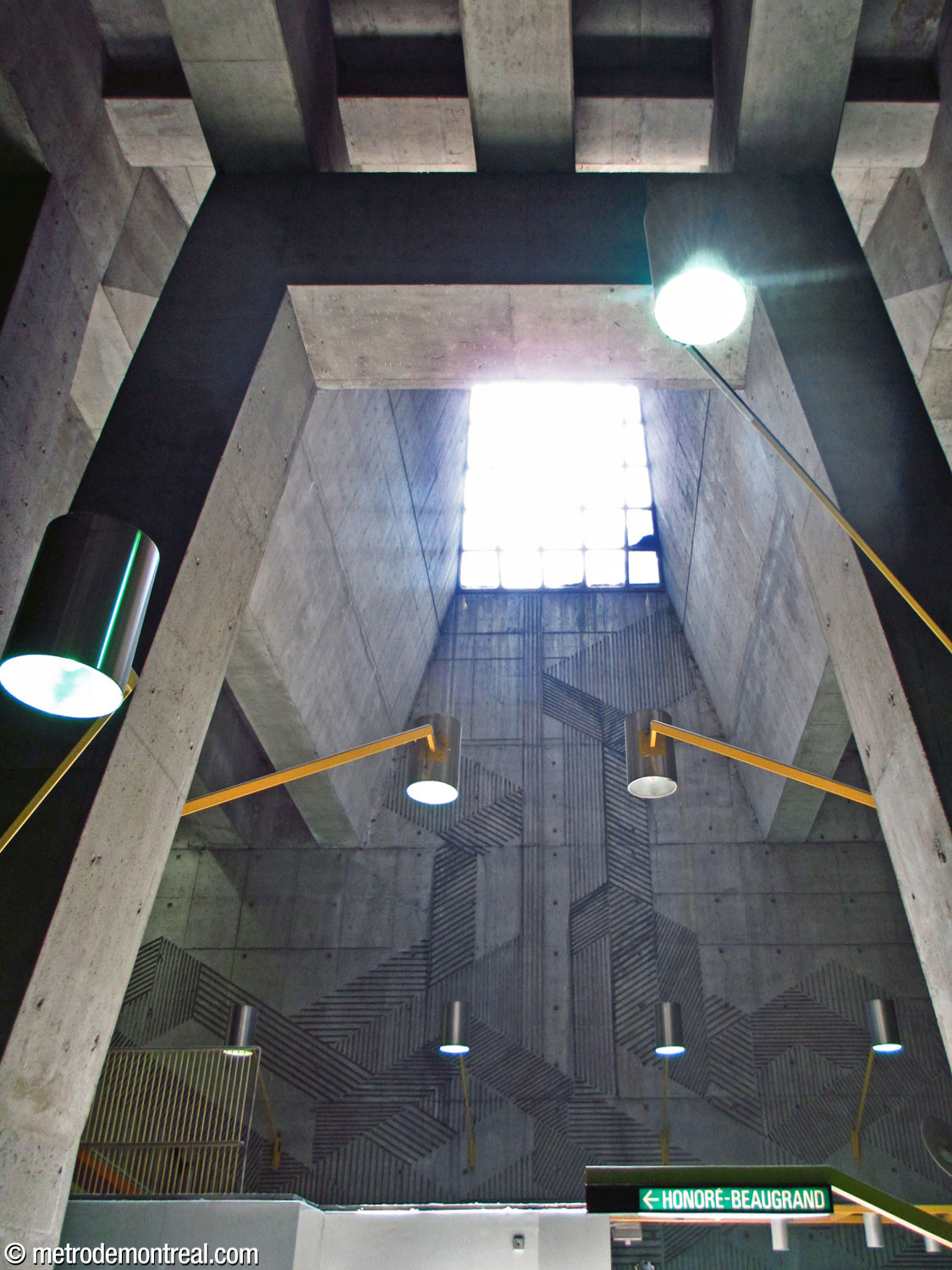 The skylight above the ticket hall in bright sunlight, with Antoine D. Lamarche and Claude Théberge's mural below.