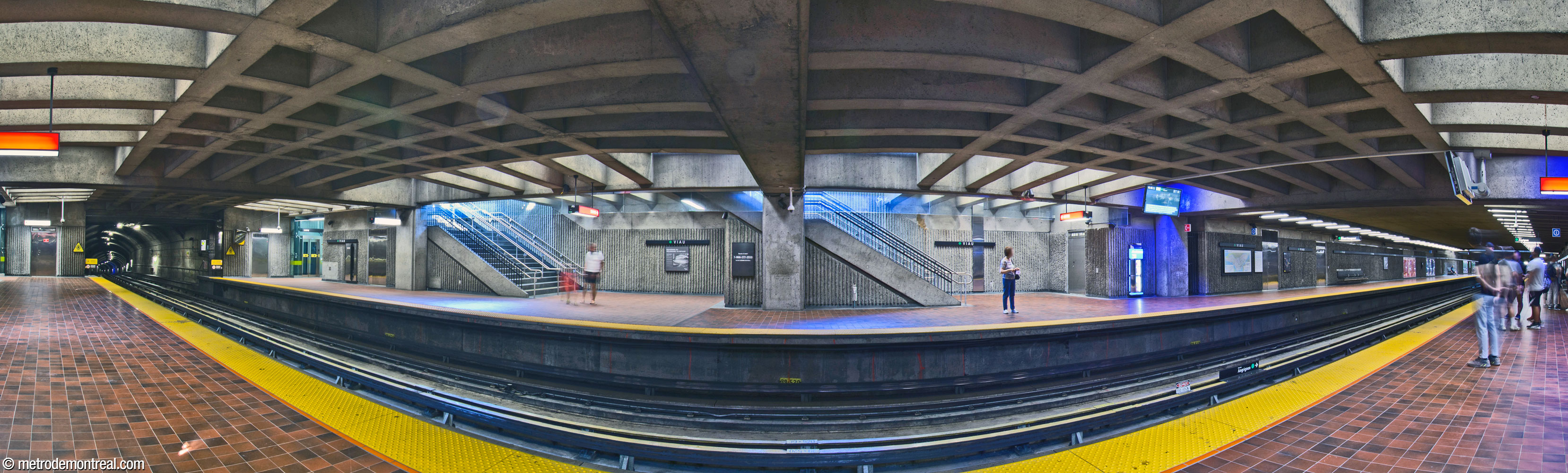 Panorama of the eastern end of the trainroom. Four stairwells, two on each side, along with two elevators, connect the shallow platforms to street level.